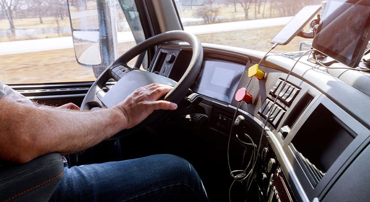 Trucker driving in heated cab